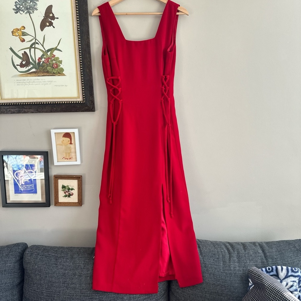 Vintage red dress with square neckline and lace up sides!